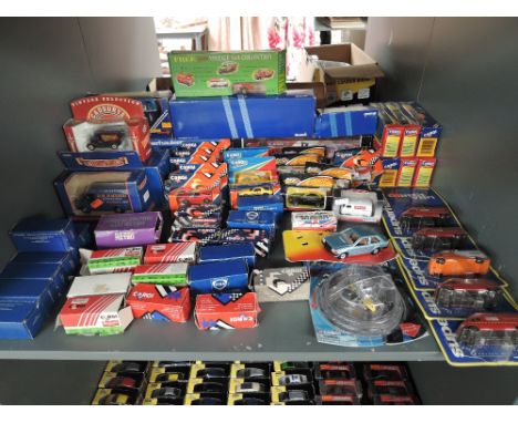 A shelf of mixed vintage Corgi diecasts 1980's and later, all boxed approx 60