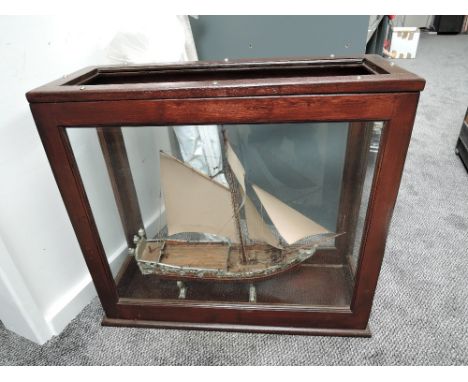 A hand made scale wooden model, Sail Boat on stand in wooden and glazed case, top piece of glass missing, size of case 65cm w