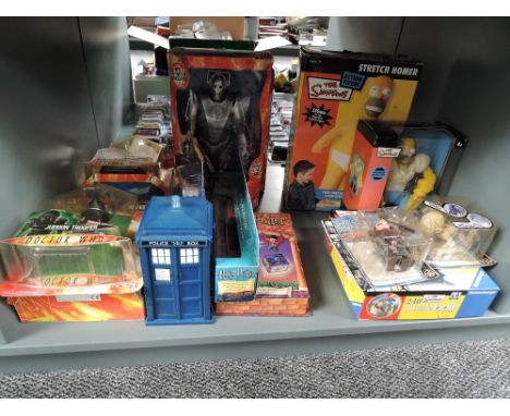 A shelf of modern collecatbles including Doctor Who, Simpsons, Harry Potter, mostly boxed