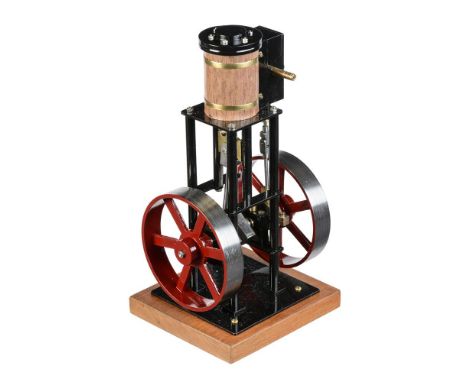 A model of a vertical live steam stationary engine, built by Mr D Russell of Frazerburgh. The single cylinder with ¾ inch bor