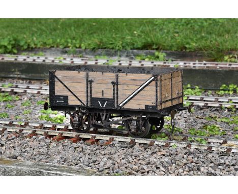 A 5 inch gauge 13 ton seven plank open wagon No M310700, of steel and wood construction with opening doors and full chassis d