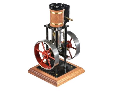 A model of a vertical live steam stationary engine, built by Mr D Russell of Frazerburgh. The single cylinder with ¾ inch bor