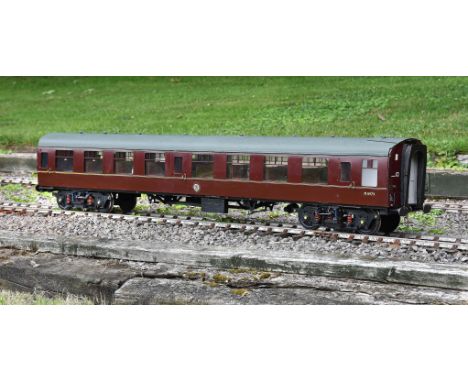 A well built 5 inch gauge British Railways passenger coach Type TSO in maroon livery with BR coaching stock crest, fitted int