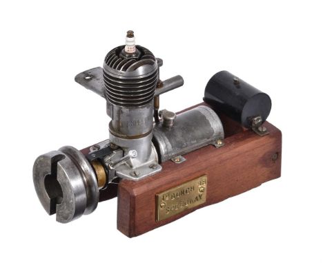 A vintage Bunch Speedway model two-stroke petrol engine, circa 1938, of approximatey 3.5cc displacement and mounted with cont