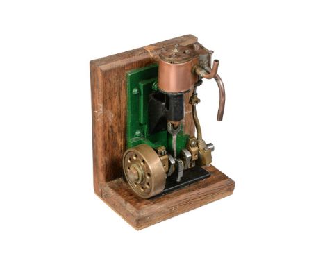 A freelance vertical side mounted live steam engine, the single cylinder clad in polished copper, open crank, eccentric drive