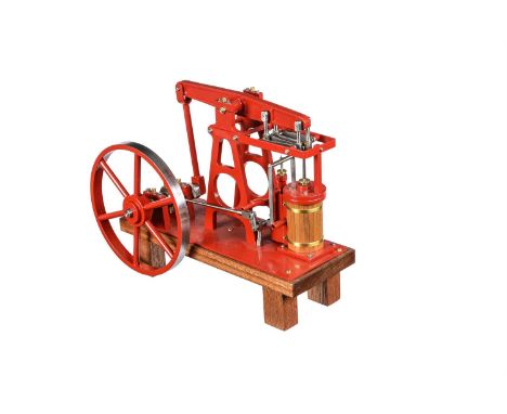 A freelance model of a live steam beam engine, built by Mr D Russell of Frazerburgh. The beam supported on 'A' frame support 
