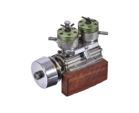 A Taplin twin MKI model marine diesel engine, probably 1960's, of 7cc displacement marked with 'TAPLIN' to frontplate and 'W 