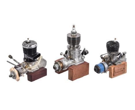 Three vintage model two-stroke petrol engines, circa 1946-47, each of approximately 3-4cc displacement and mounted on wooden 