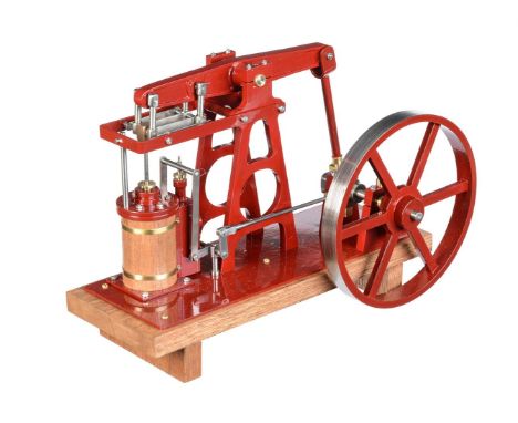 A freelance model of a live steam beam engine, built by Mr D Russell of Frazerburgh. The beam supported on 'A' frame support 