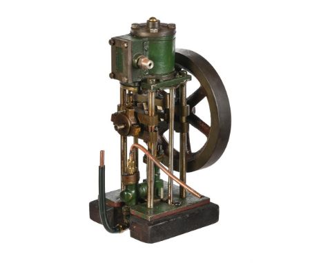 A well engineered model of a small vertical live steam single cylinder steam engine, driving reciprocating pump, the metal la