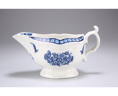 A WORCESTER SAUCEBOAT, CIRCA 1775,&nbsp;the moulded body painted in blue with floral decoration, on an oval raised foot, blue