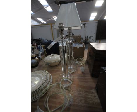 A Pair of modern glass column table lamps and a third similar lamp. (3)