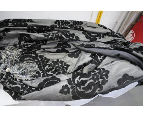 A Large pair of embossed damask leaf pattern curtains in shades of black and grey c/w tie backs. CONDITION REPORT: 1 curtain 