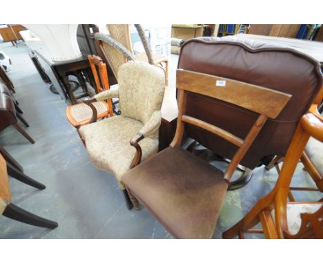 A 19th century upholstered elbow chair with a padded back serpentine seat, outswept padded arms, a Victorian dining chair, a 