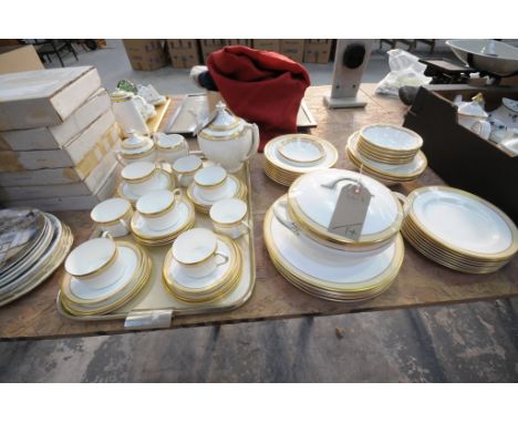 An Extensive Coalport " Aura " gilt edged tea and dinner service comprising teapot, tureens, dinner and side plates, cups and