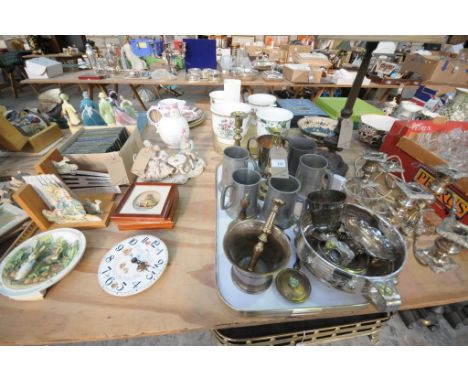 A Collection of metalware including a brass pestle and mortar, pewter tankards, brass candlesticks, a pair of silver plated c