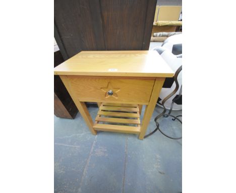 A Modern light oak single drawer side table with a slatted under shelf.