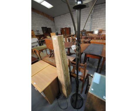 A Composition stone pyramidal lamp standard and a modern wrought iron lamp standard. (2)