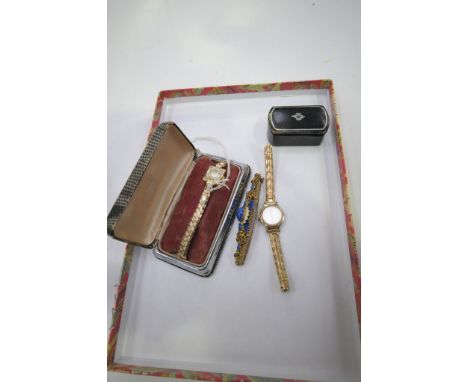 2 Ladies gold coloured bracelet wrist watches, a Victorian gilt and blue stone brooch and a patch box.