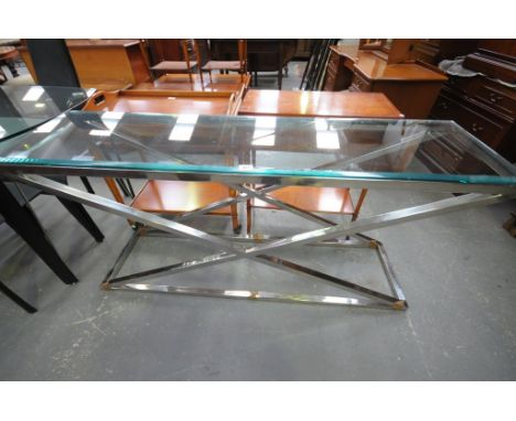 A Modern tubular chrome and glass top console table.
