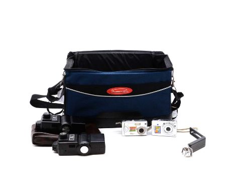 A camera bag containing two Vivtar flashguns, two compact cameras and various accessories.