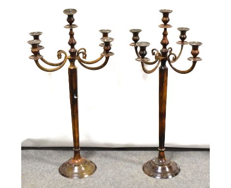 Pair of contemporary metal five-light candelabra, scrolled branches, tapering hexagonal column, stepped circular feet, 97cm h