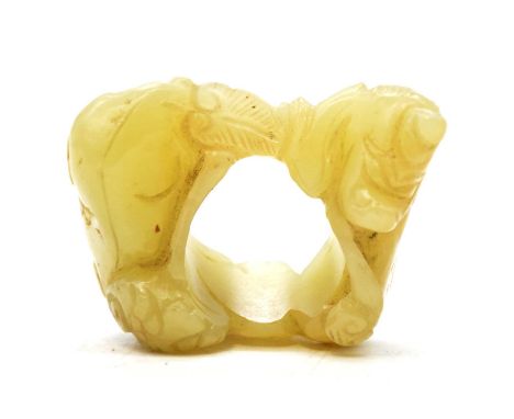 Chinese jade archers thumb ring, carved with a lion and ram, 5cm.Condition report:Please see additional uploaded images of th