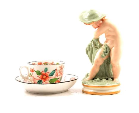 Unusual Royal Worcester figural spill vase, modelled as a young boy casting a fishing net, with broad rim hat, celadon green 