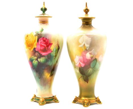 Near pair of Royal Worcester vases and covers, painted with Hadley style roses signed C V White, and Fucias painted by A Shuc