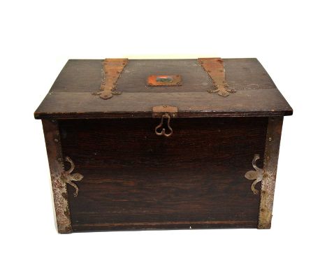 Early 20th century oak coal bin, Arts and Crafts style, the cover mounted with small rectangular enamel plaque of a Viking sh