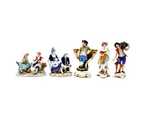 Collection of sixteen British and Continental porcelain figurines, including a pair of twin-light candelabra of male and fema