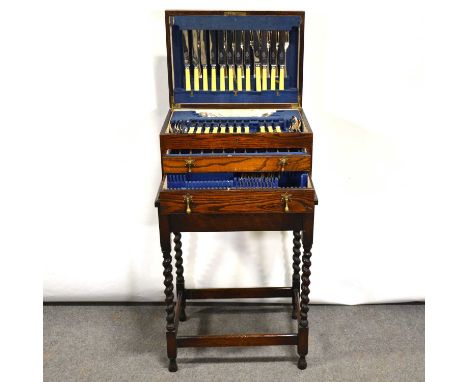 Canteen of silver plated cutlery, twelve place setting, fitted in an oak canteen box, and an oak table with barley twist legs