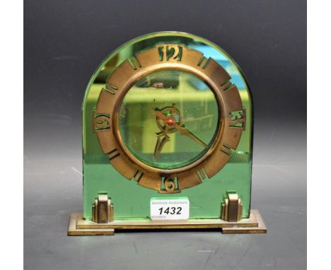 An Art Deco green plate mirror and brass mantel clock