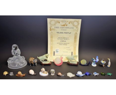 A pair of Chinese carved jade horses; a Herend model of a cockerel; a Royal Worcester model of a snail; other animal models