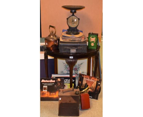 A set of Salters scales; a copper kettle; oil cans; a D-shaped table; a typewriter; etc