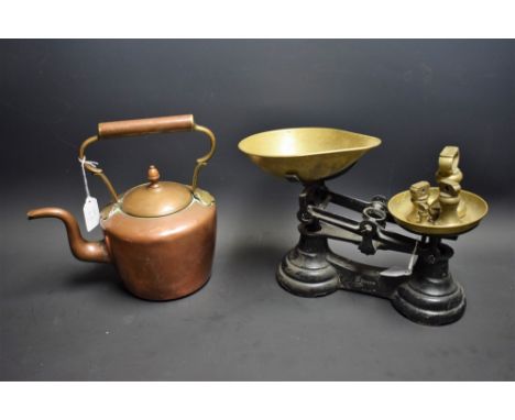A set of cast iron and brass kitchen scales and weights; a Georgian copper kettle (2)