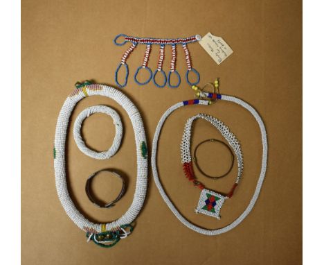 A quantity of beadwork jewellery, white beaded collar, bangle; a Pondo mitten; etc
