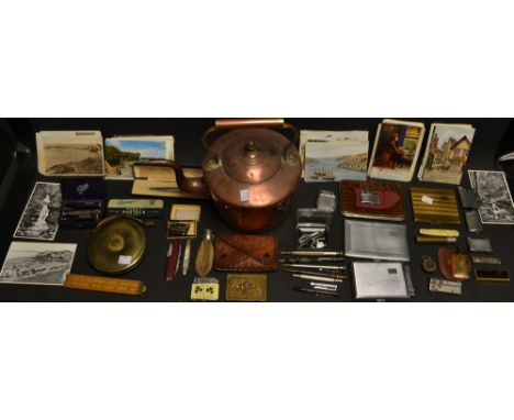 A Ronson Penciliter, combined pen and lighter, boxed; a Ronson lighter; others, similar; a brass cased tape measure; a coin p