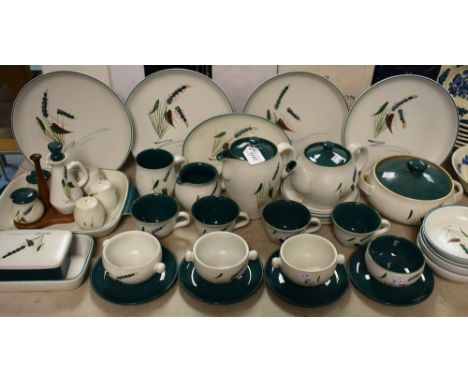 A Denby Greenwheat part dinner and tea service comprising dinner plates, side plates, bowls, teapot, coffee pot, cups and sau