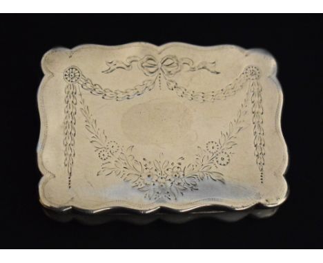 An Edwardian silver shaped rectangular snuff box, chased with swags and flowers