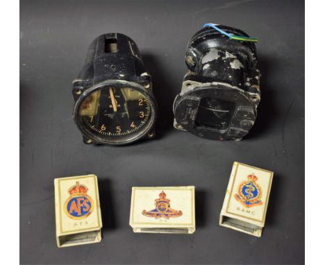 A US ARMY compass Type B-16;  a Kollsman tachometer; three matchbox covers Royal Army Medical Corps, Royal Artillery, Auxilia
