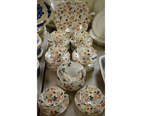 A Tuscan part tea service, in the Imari palette, printed marks, comprising cups, saucers, side plates, bread and butter plate