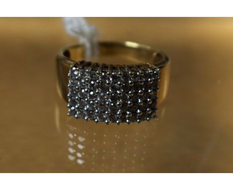 A rectangular diamond cluster ring, set with a panel of forty five round cut diamonds, 9ct gold shank, 5.2g gross