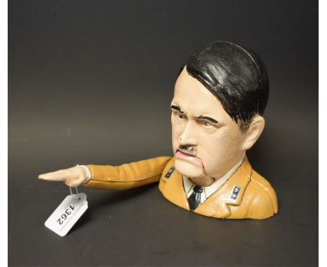 A reproduction novelty cast metal nutcracker, as a Hitler salute 
