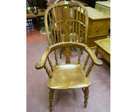 A 19th Century Windsor splatback smoker's bow armchair, 104 x 66 cms, later re-stained and re-polished