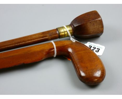 A mahogany blade edged walking cane with golf club head grip and another wooden shafted walking cane with hexagonal shape gri