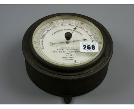 An RNLI fisherman's aneroid barometer marked 'Dollond, London', no. 2674, 16 cms diameter