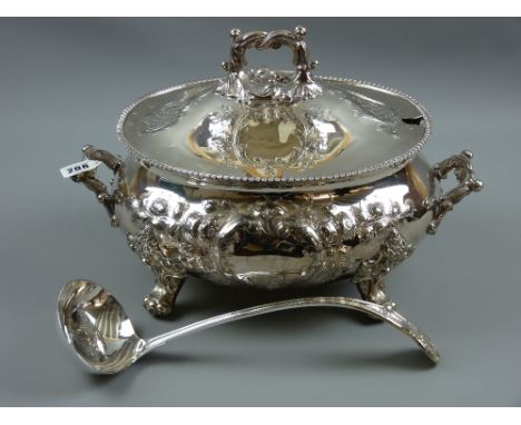 A fine quality heavy oval electroplated tureen having a feather edge rim with raised scrolled and floral decoration, scrolled