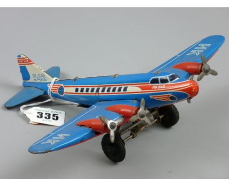 An HK542 tinplate airplane, a clockwork vintage lithographed toy by Huki, US Zone, Germany, 22 cms long, 25 cms span