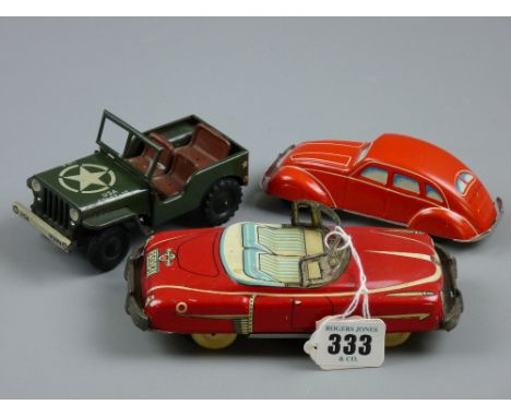 Three vintage tinplate vehicles including a US Army jeep marked 'Made in US Zone, Germany', 17 cms long the largest